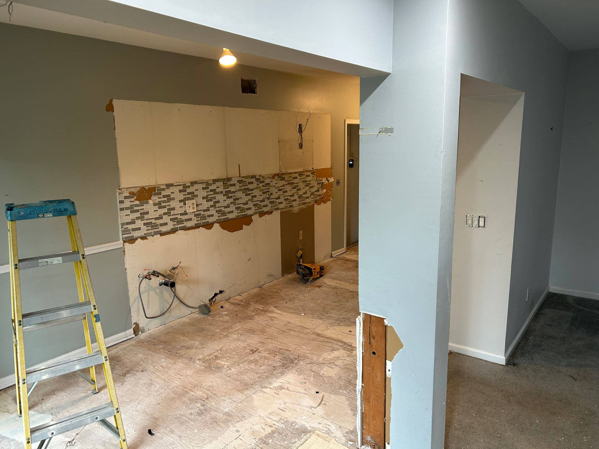 Old refrigerator and appliance removal with kitchen space cleared in New Jersey — after
