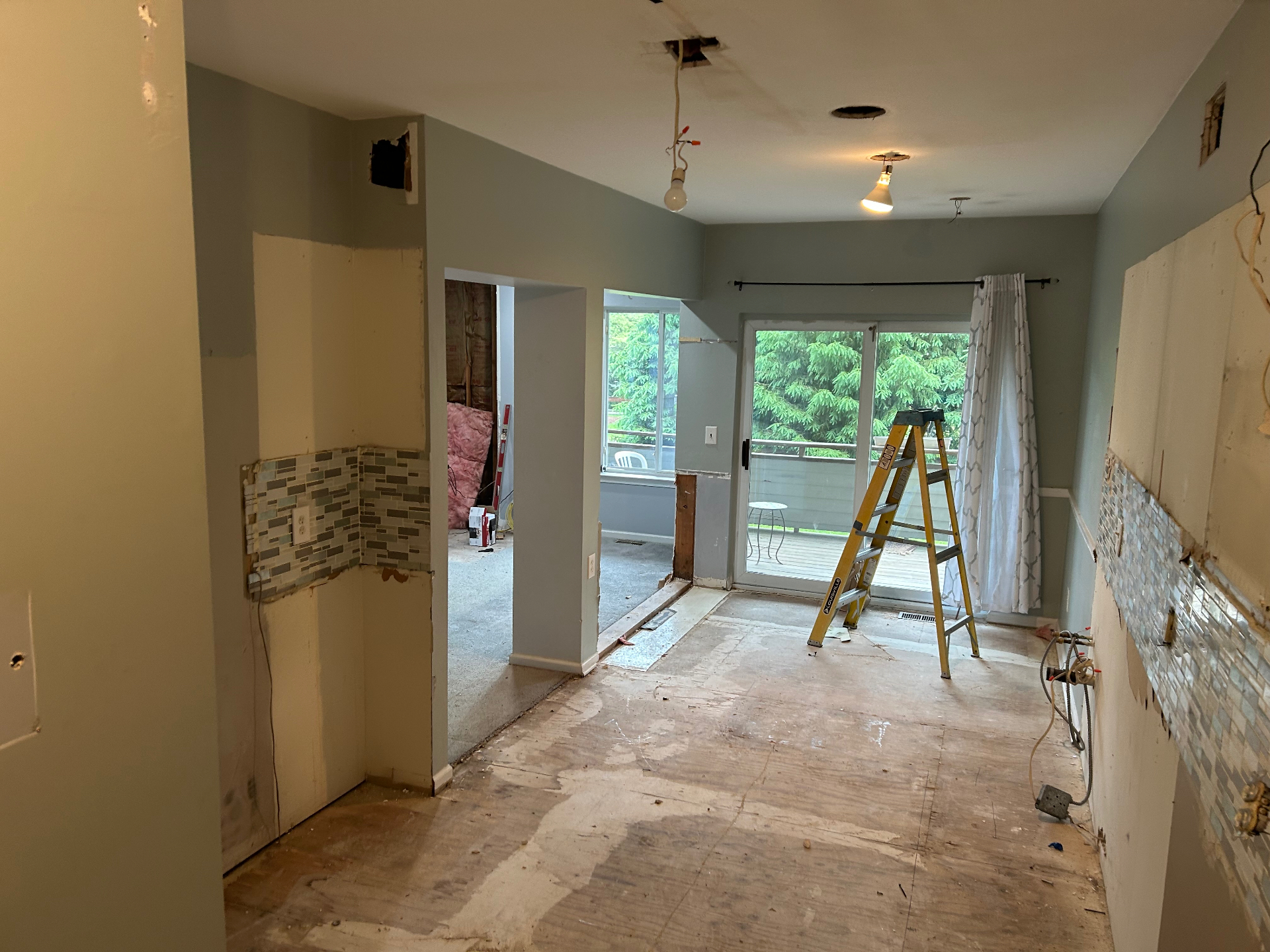 Kitchen and dining demo debris removal with open floor space restored in New Jersey — after